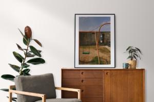 Picture frame mockup psd on a retro sideboard